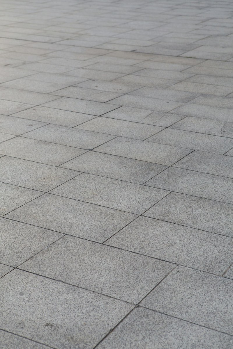 Close-up of mid-grey concrete-look porcelain floor tiles