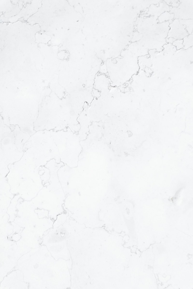Close-up of white marble-look porcelain with faint grey veining