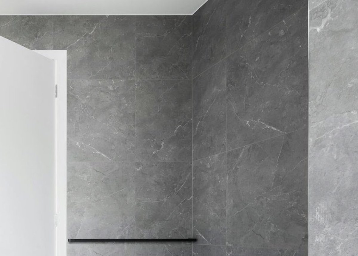 Close-up of grey marble-look porcelain with soft white veining